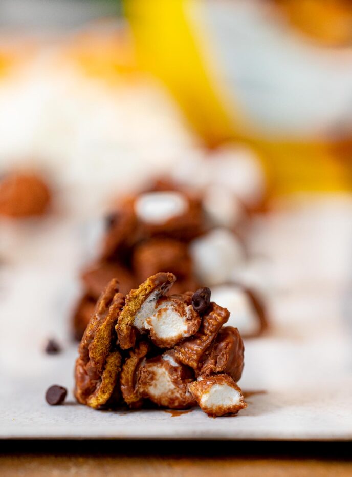 No-Bake S'mores Cookies with bite removed on parchment paper