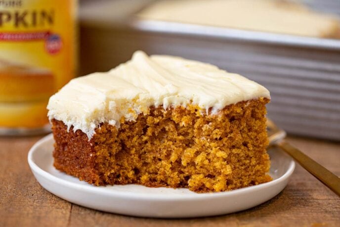 Pumpkin Sheet Cake slice on plate with bite removed