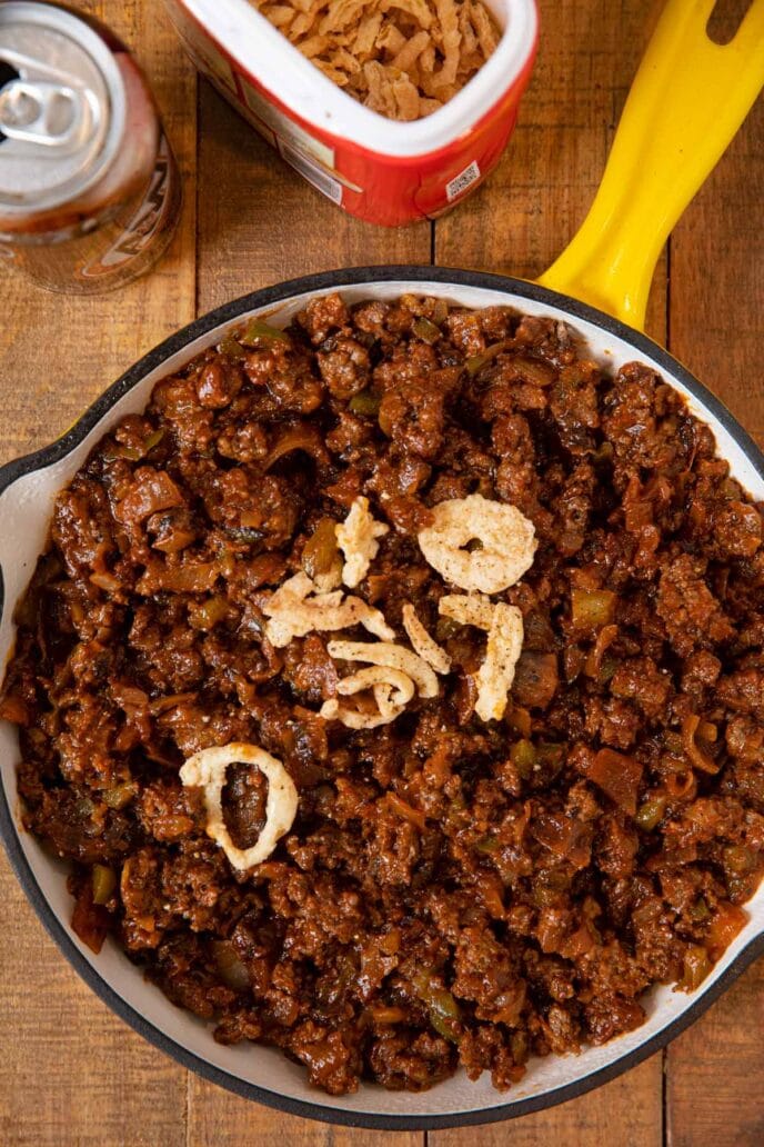 Root Beer Sloppy Joes sandwich filling in skillet with fried onions