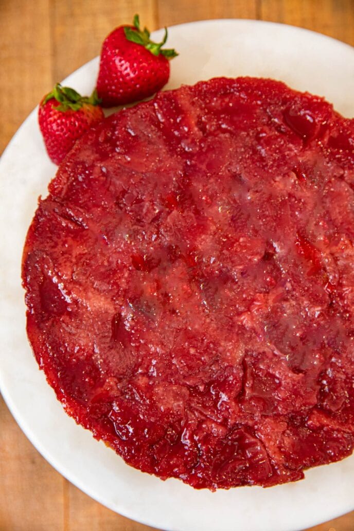 Strawberry Upside Down Cake top-down view on cake stand