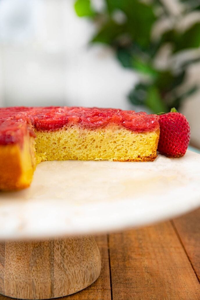 Strawberry Upside Down Cake cross-section on cake stamd