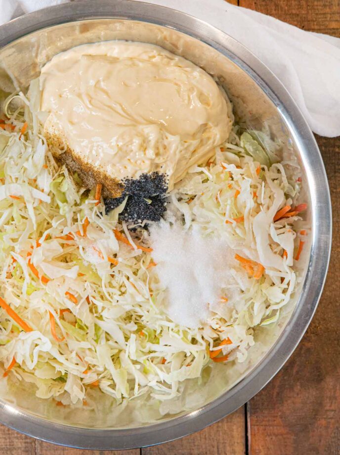 Sweet Slaw ingredients in large metal mixing bowl