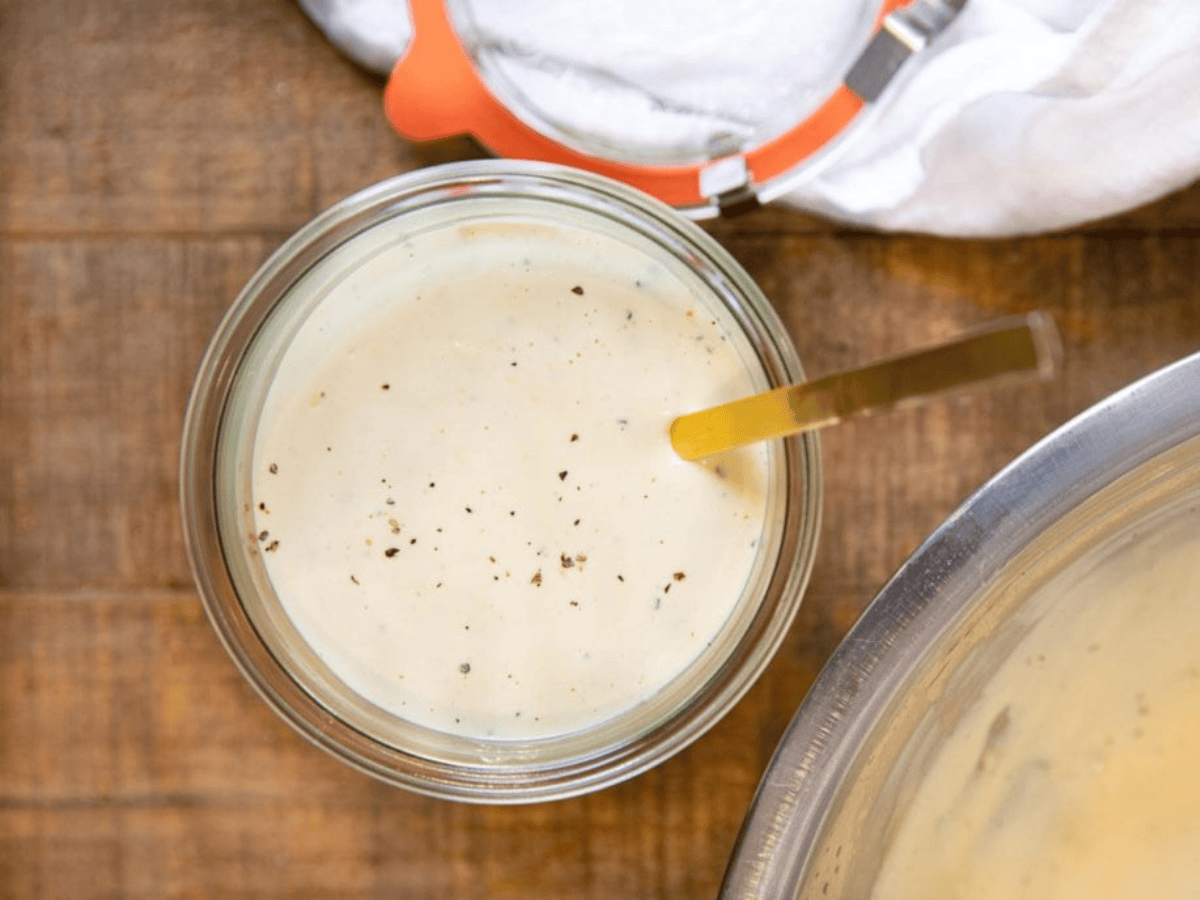 jar of sauce with a spoon in it