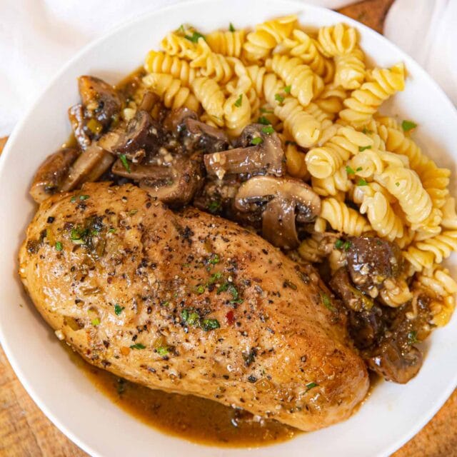 Braised Chicken Breast and Mushrooms serving on plate