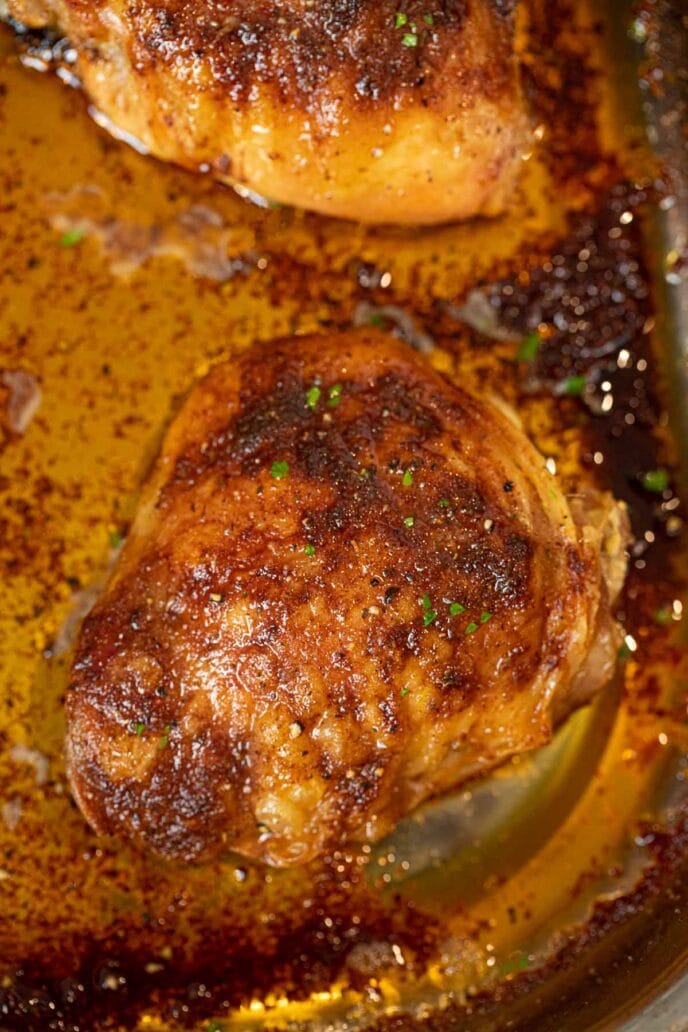 Crispy Rotisserie Chicken Thighs in roasting pan