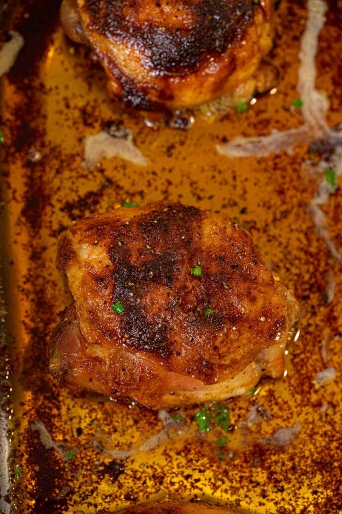 Crispy Rotisserie Chicken Thighs in roasting pan