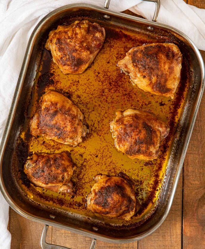 Crispy Rotisserie Chicken Thighs in roasting pan