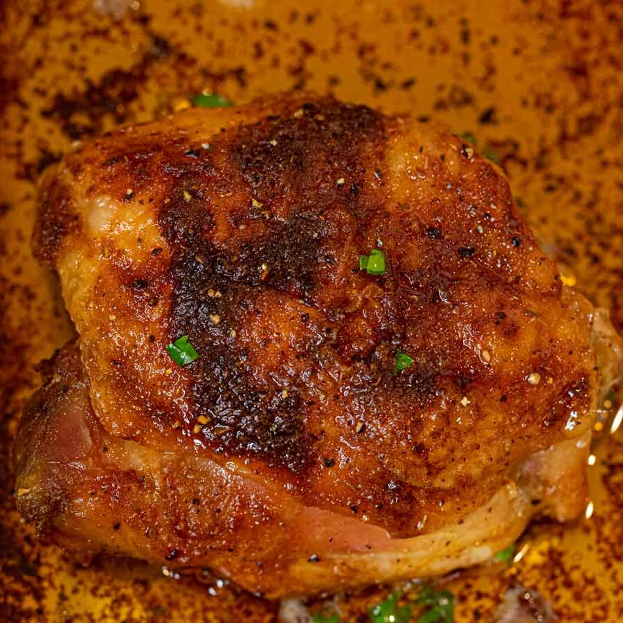 Crispy Rotisserie Chicken Thighs in roasting pan