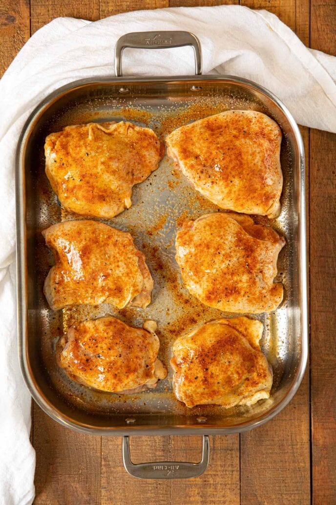 Crispy Rotisserie Chicken Thighs in roasting pan