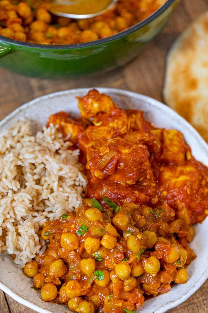 Chana Masala in bowl with rice and Indian Tomato Chicken