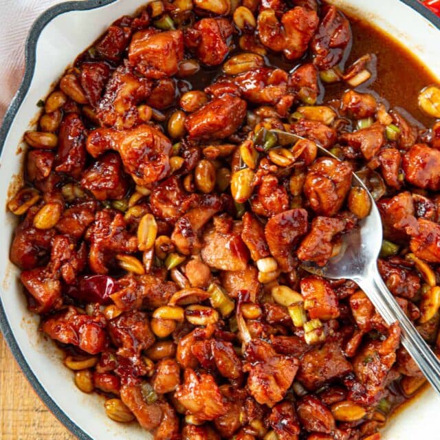 Kung Pao Chicken in pan with spoon