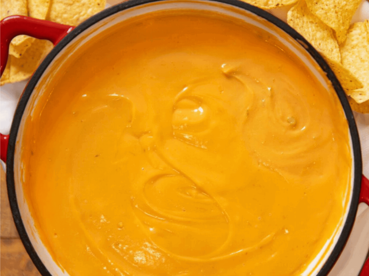 Melted cheese sauce in red pot