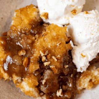 Serving of cobbler with scoops of vanilla ice cream