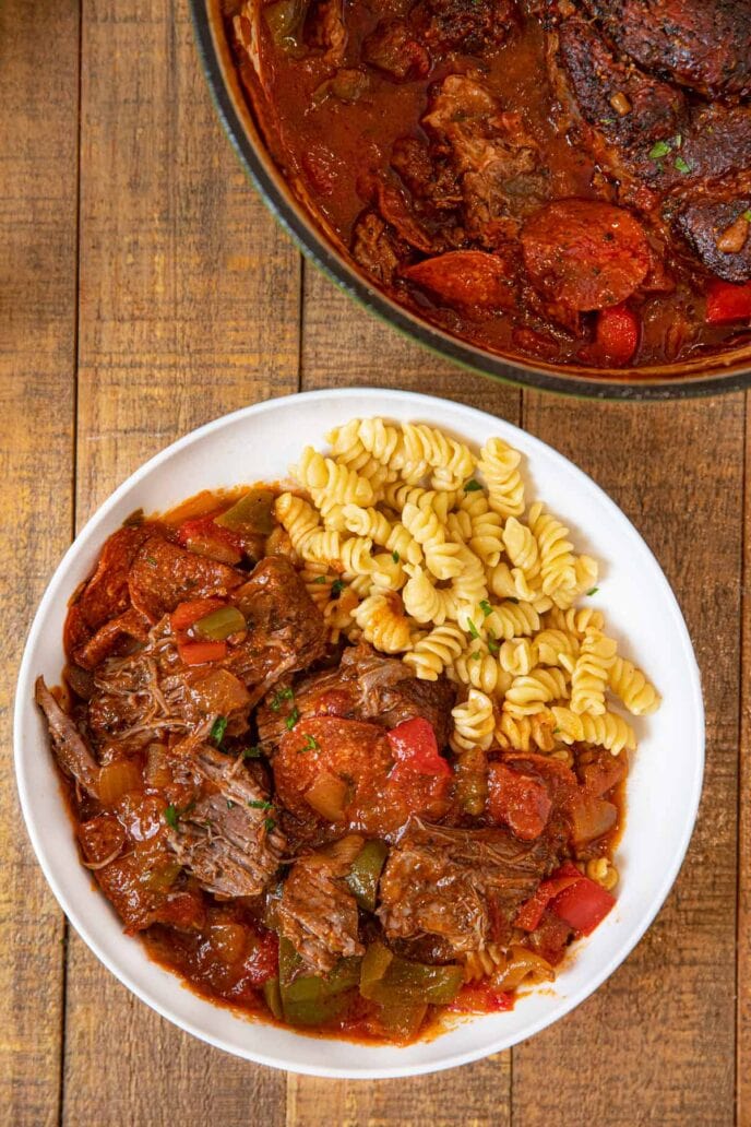 Pepperoni Pizza Pot Roast serving on plate with rotini pasta