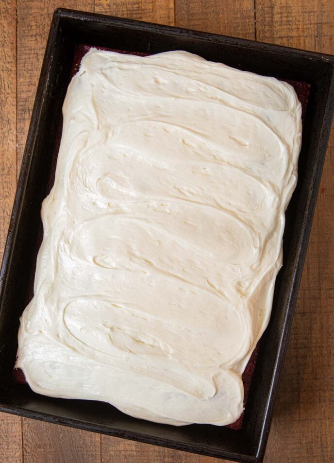 Red Velvet Sheet Cake in baking pan with frosting