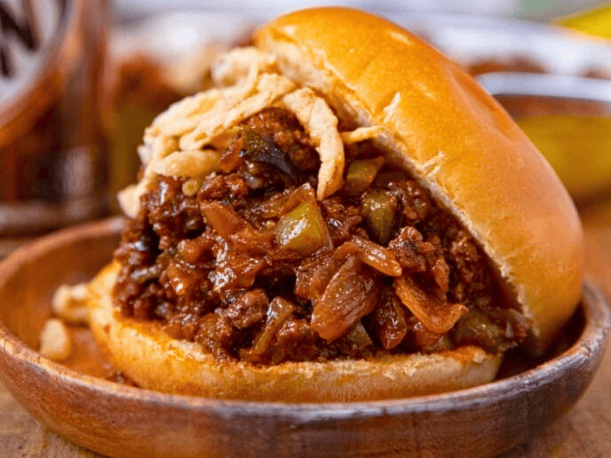 Bun sliding off top of meat mixture sandwich