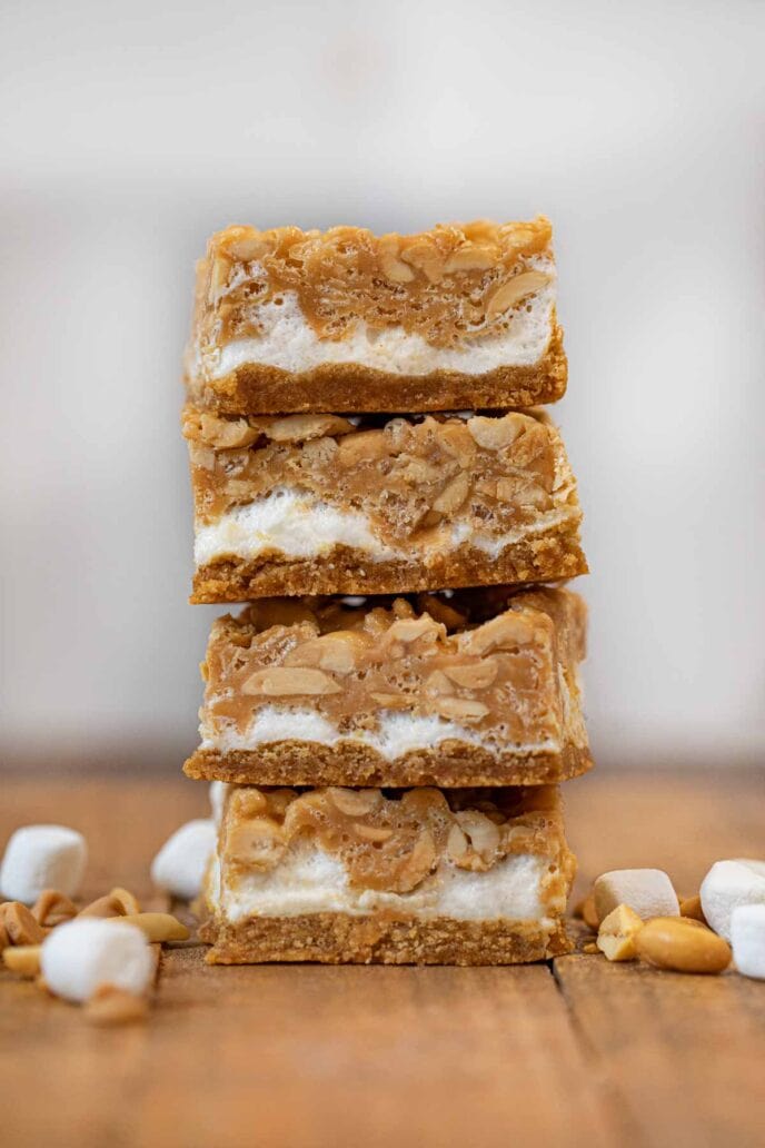 Salted Peanut Chew in stack on brown board