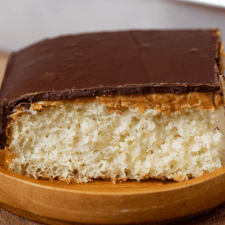 Slice of dessert on a wooden plate