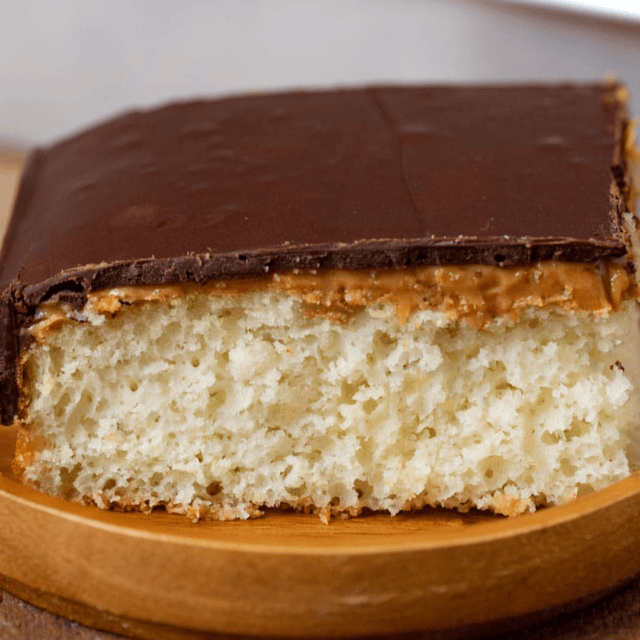 Slice of dessert on a wooden plate