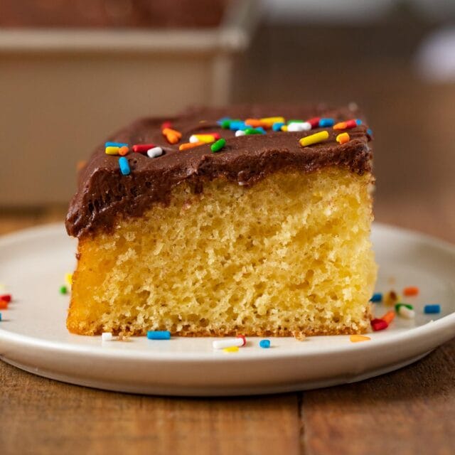 Yellow Sheet Cake with Chocolate Frosting slice on plate