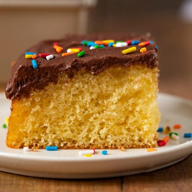 Yellow Sheet Cake with Chocolate Frosting slice on plate