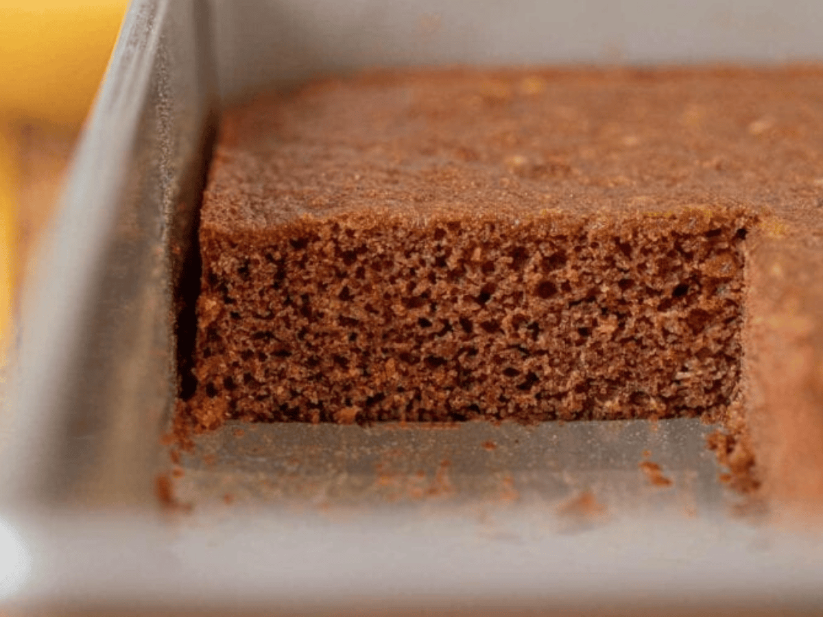Side view showing piece of cake removed from baking dish