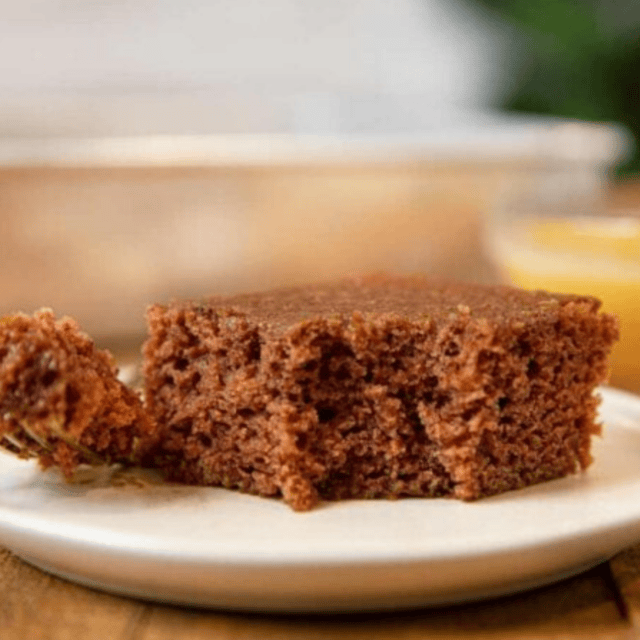 Cake served on white plate with bite taken out