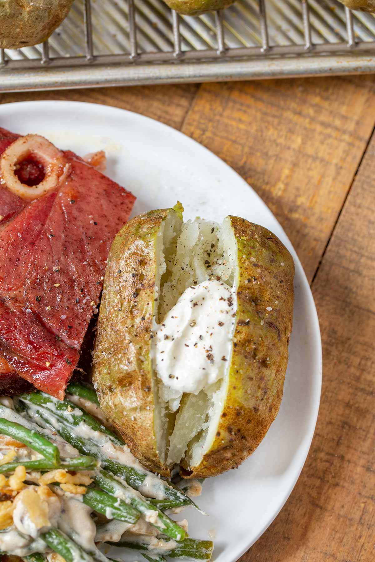 Baked Potato with sour cream on plate