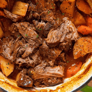Roast and potatoes in pot ready to serve