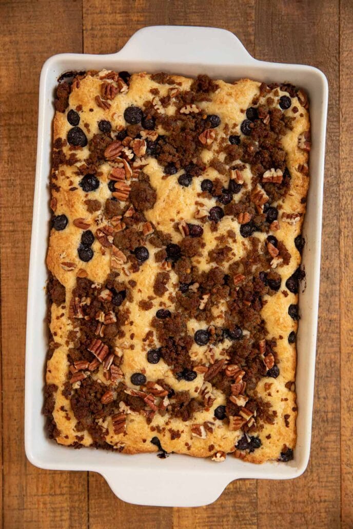 Sausage Blueberry Casserole in white baking dish on wooden table