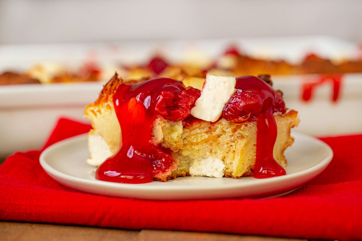 Cherry Danish Breakfast Bake on white plate with red napkin