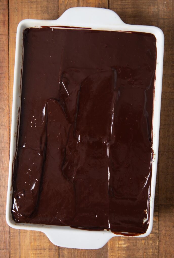 Chocolate Mint Brownies in baking dish with chocolate coating