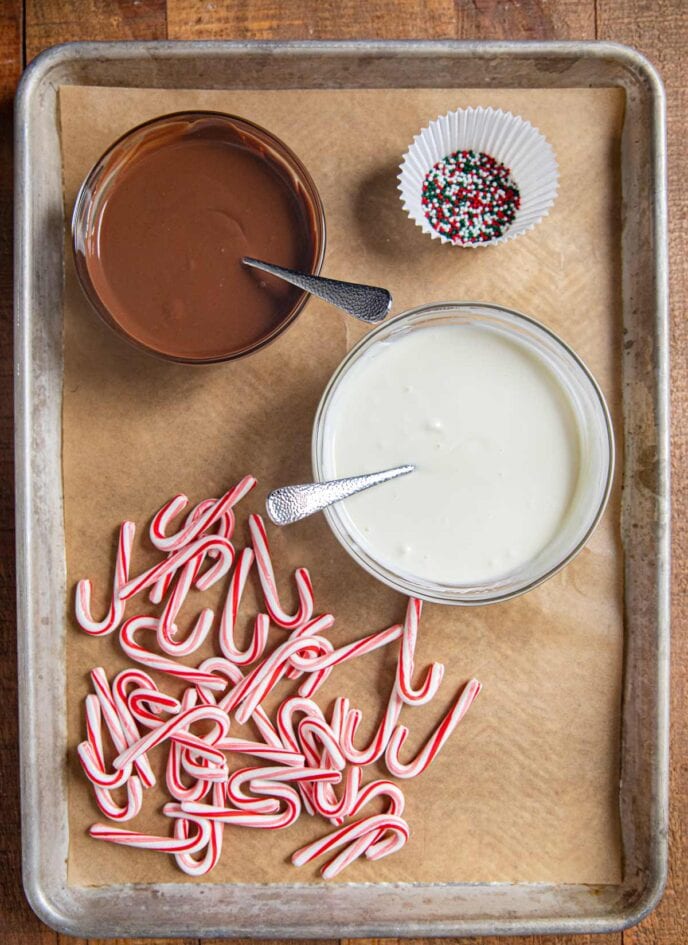 Candy Canes and melted chocolate on baking sheet