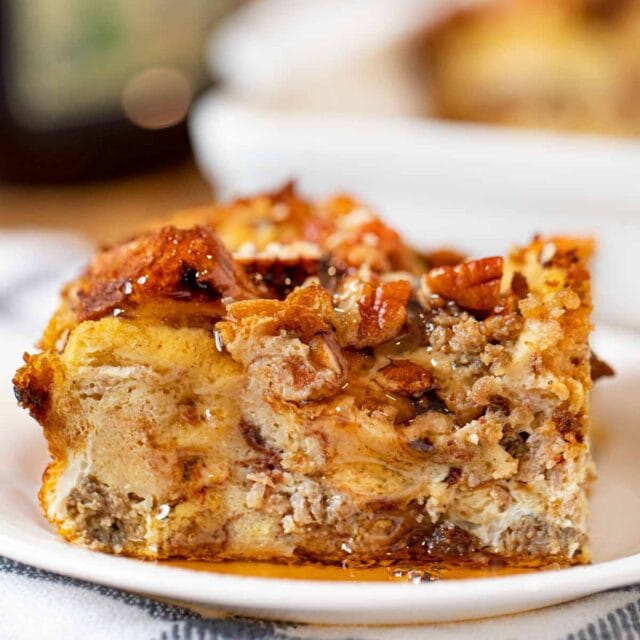 Cinnamon Raisin Sausage Breakfast Bake serving on plate with maple syrup