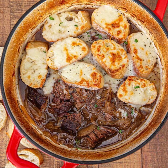 Cropped French Onion Pot Roast with Croutons and cheese in red pot