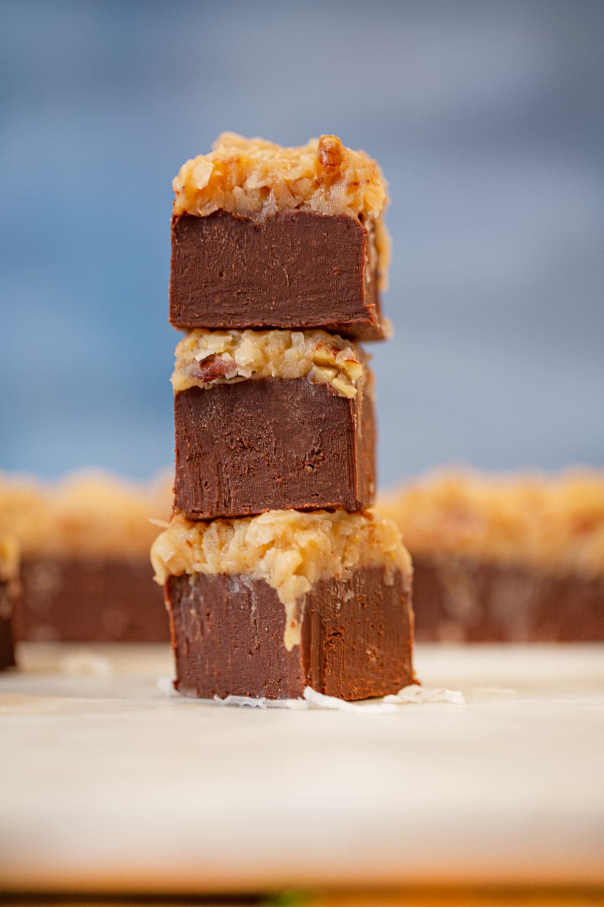 German Chocolate Fudge in a stack on marble