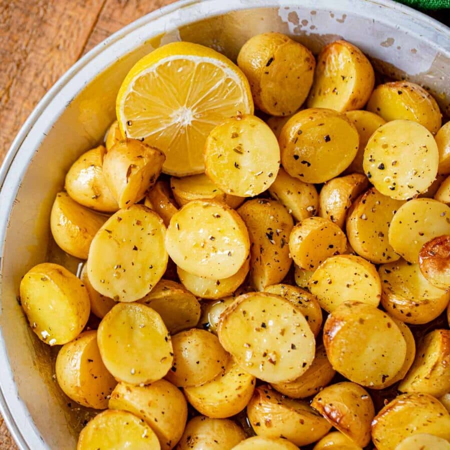 Greek Lemon Potatoes in pie plate with lemon