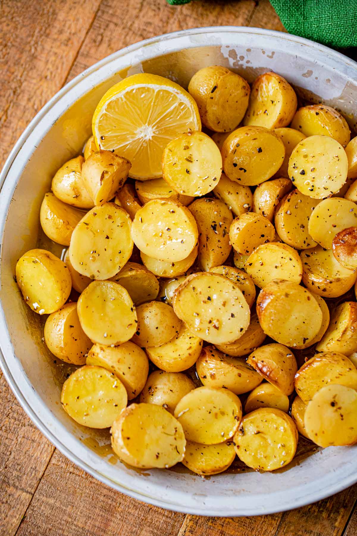 Greek Lemon Potatoes in pie plate with lemon