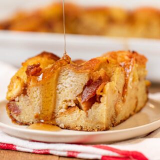 Maple Bacon French Toast Bake with syrup pouring on it