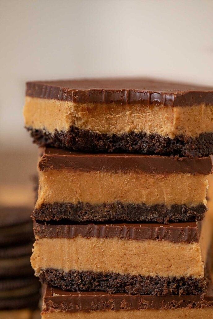 Bite of Peanut Butter Oreo Bars in a stack