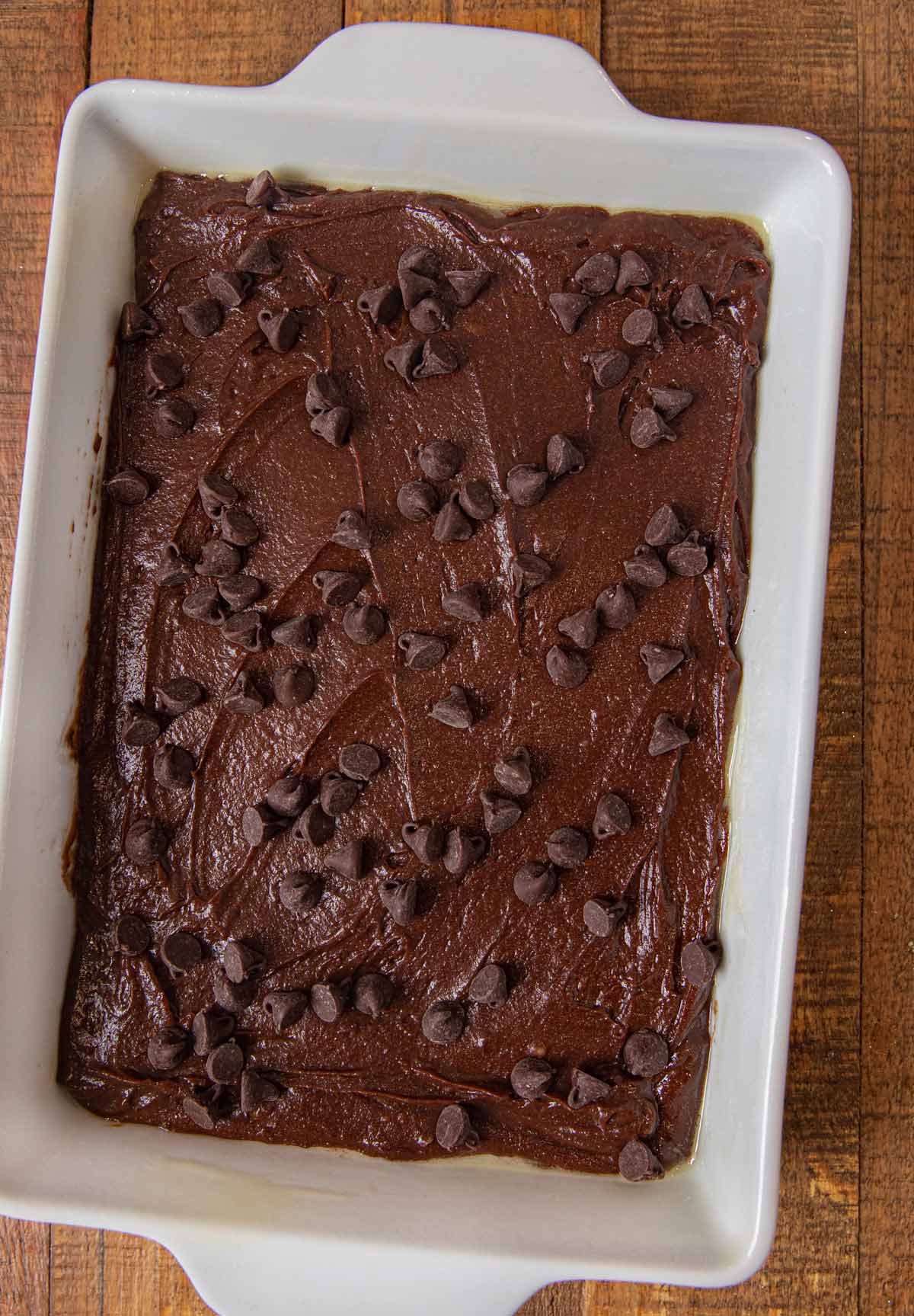 top-down view of Peppermint Bark Brownies brownie layer in baking dish before baking