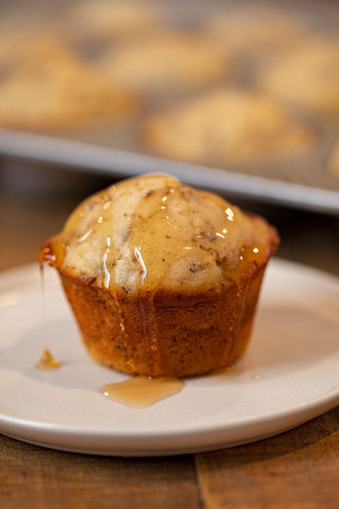 Sausage Pancake Muffin covered in maple syrup