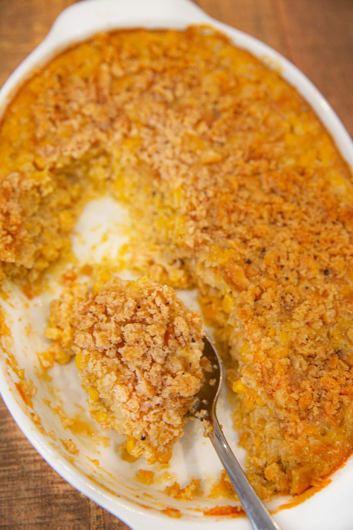 Baking pan of Scalloped Corn with spoon