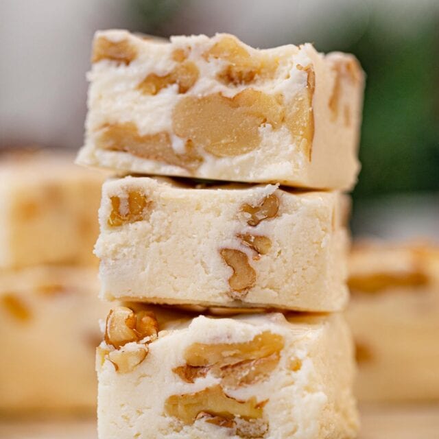 two bites of See's Vanilla Walnut Fudge in stack
