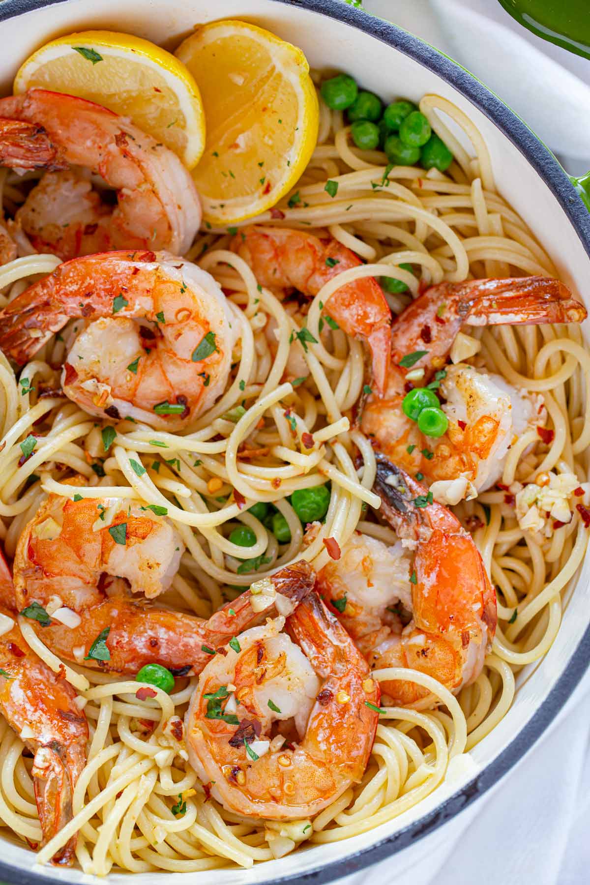 Shrimp Scampi Pasta with lemon and peas in large green pot