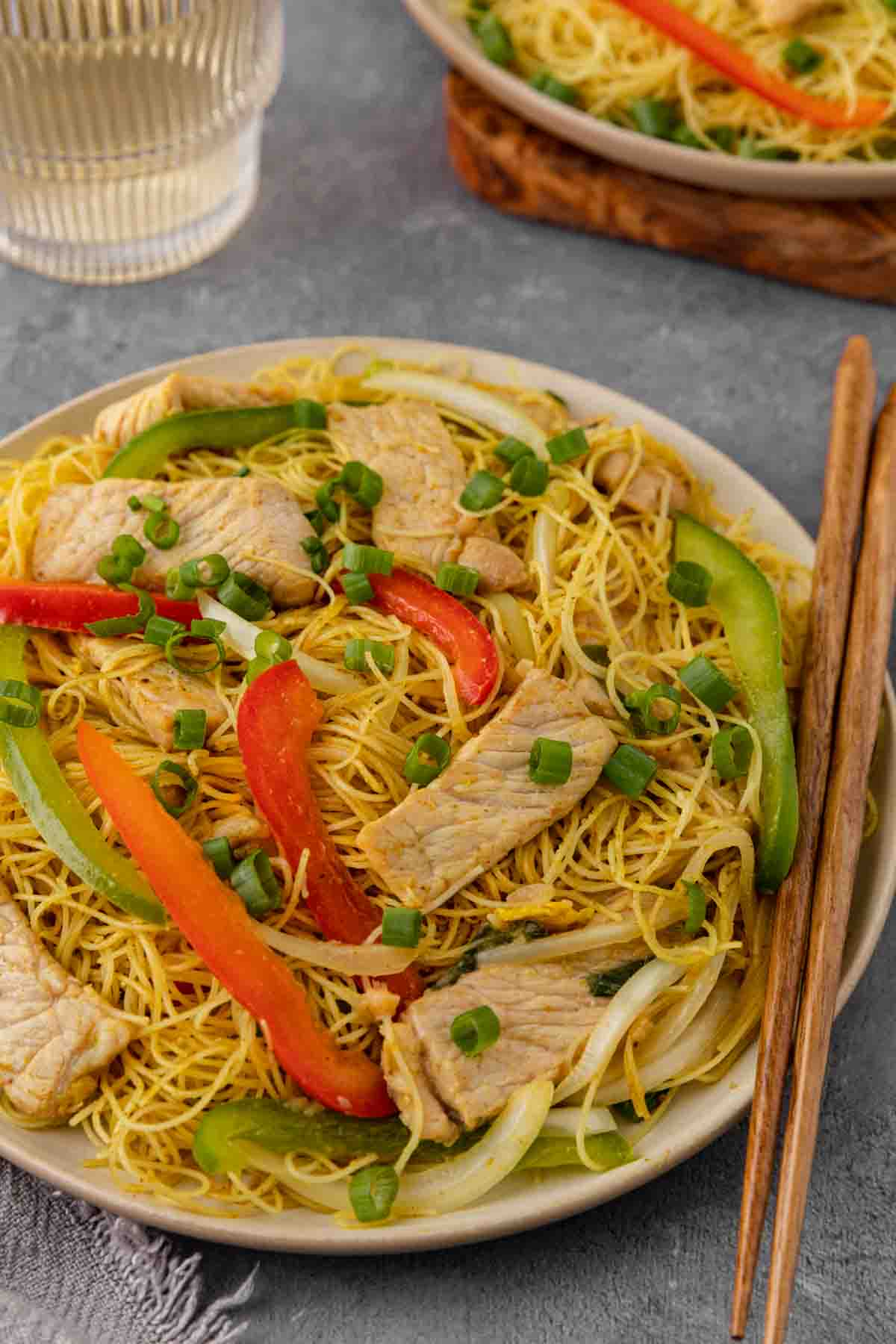 Singapore Noodles in bowl with chop sticks