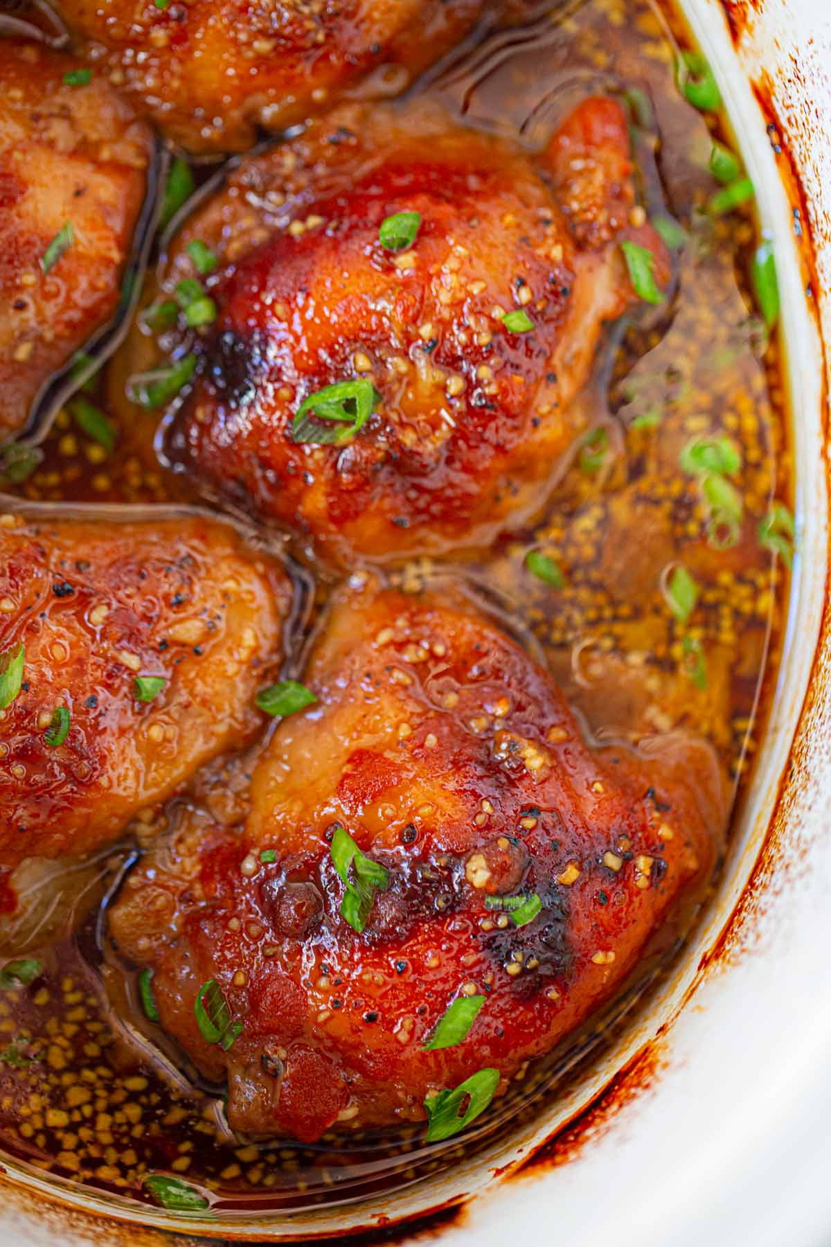 Slow Cooker Brown Sugar Sriracha Chicken topped with green onions