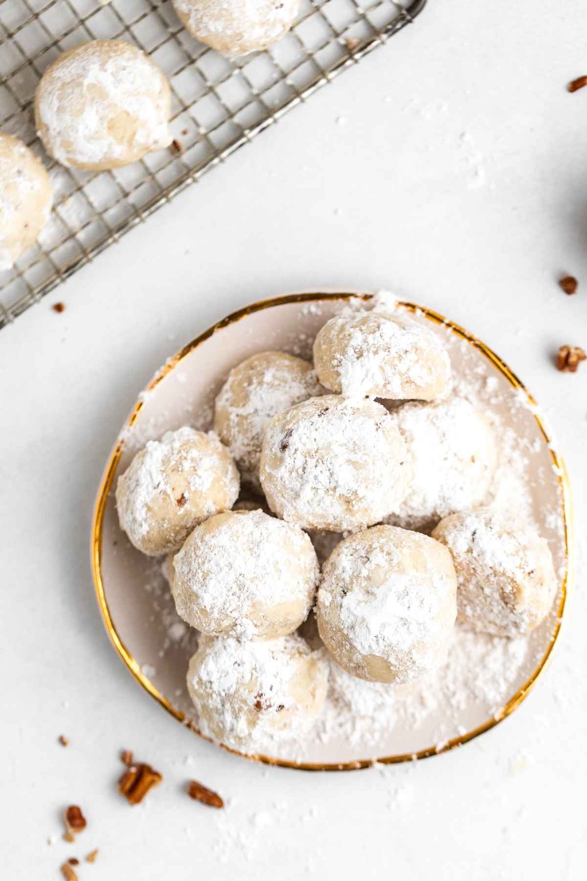 Snowball Cookies on serving plate with bite taken