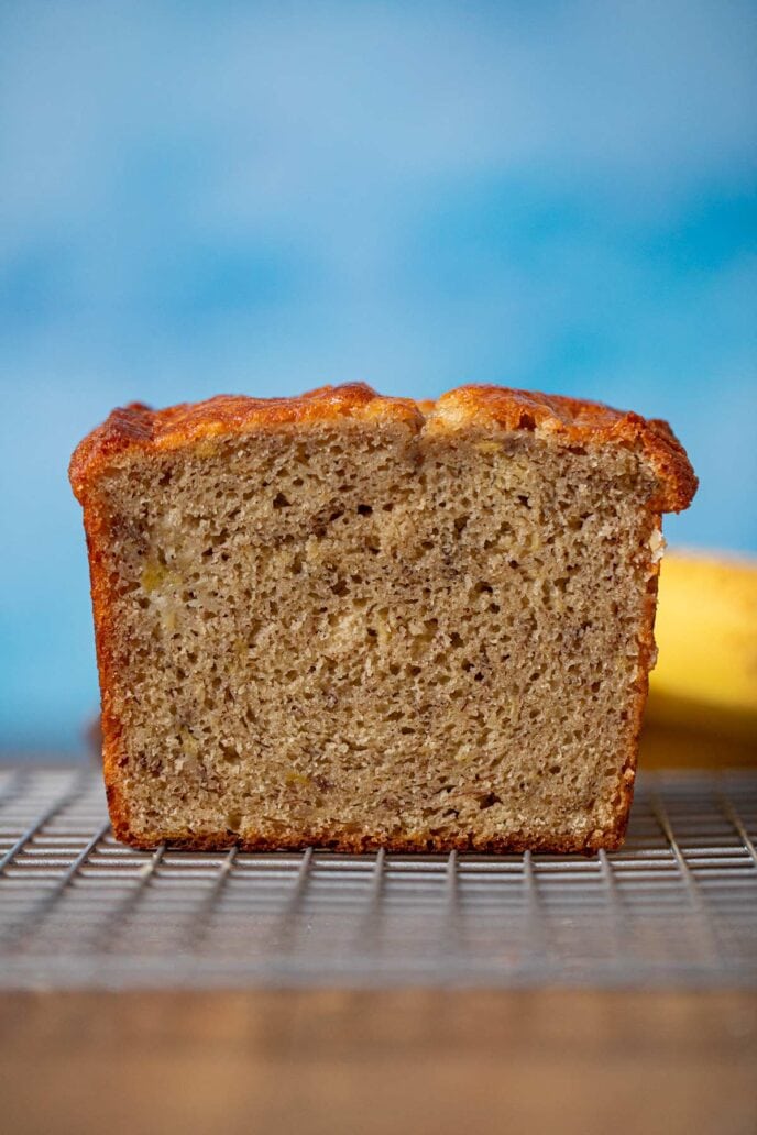 Sour Cream Banana Bread loaf cross-section on cooling rack