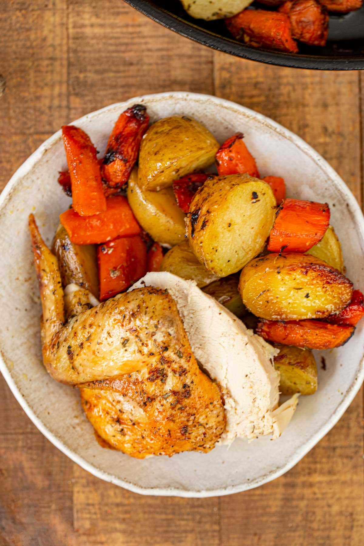 Beer Can Chicken served in bowl with vegetables